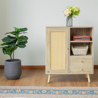 Wooden cabinet with a plant and decorative items on a wooden floor.